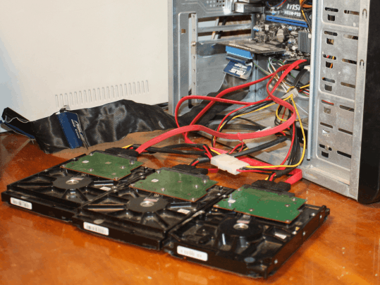A photo of a typical data recovery workstation with several connected SATA disks